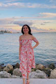I usually order S but I saw some reviews saying that XS was the same fit. It was a little tight on my shoulders but not a big deal to me. I loved it! It makes my waist look great as well! Perfect dress! - Arantxa M.