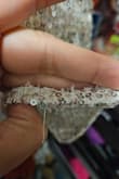The bottom of the dress has loose strings and lost many sequins in the bag when I took it out of the package. - Laura A.