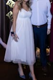Was perfect for my bridal shower! My mum did have to take in the straps about 2 inches and then we cut the extra. All in all, it was still super fun, and it was something poofy (but not too poofy) and tea length. So, this was perfect! - Kate P.