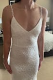 First, I was very surprised and pleased at how well this fits. I don't need any alterations or tailoring. I'm earing this for my beach wedding. It's light, beautiful, and makes me feel beautiful. - Bary R.