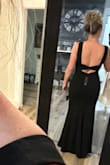 What a great dress. Fits perfect in all the right places. Initially thought it was a little snug getting it on, but then realized there was a zipper on the side. The material is heavy enough for it to be warm and hide imperfections. I'm able to wear it without a bra, which is a nice feature! Tried on with 4" & 3" heels, and the length is perfect. - Jennifer J.