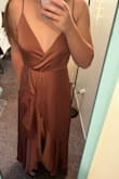 I love this dress and received sooo many compliments on it. It fit perfectly and was the exact length that I could get away with using 2in heels. Any longer and I would have needed to hem it. My only issue with the dress was that it showed EVERYTHING. If it got wet, it was very obvious. And at the end of the night, someone spilled on the dress and ended up staining the bottom of it. I hope it comes clean at the dry cleaners. It also was very deep and wide in the chest and I had to use fashion tape to secure it to myself or I would have been flashing people all night. It also came extremely wrinkled and took me several hours to steam out the majority of them. - Brooke B.
