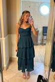 I really enjoyed wearing this dress for a fall wedding! Fits true to size, is comfortable, and flattering. It had adjustable straps and I didn't need to wear a bra. The only minor thing is the different layers of the dress were slightly lopsided. Not sure if it was cut incorrectly? It wasn't that big of a deal, but I ordered two of the same dress to compare each layer was crooked on different sides. - Marla W.