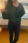 I fell in love with the color and fit the moment I saw this sweater, and I just had to buy it! This is the perfect color sweater for the holidays; I would say that it's more in-between an emerald green and a forest green. It runs true to size. I probably could have sized down to an XS, but I chose the S because I wanted it to be comfy and a little longer since it is cropped. I think if I chose an XS, it might be a little too short! Definitely a sweater to wear with high-waisted pants, or at least midrise. My arms are definitely shorter than the model, but I think the sleeve style is still super cute! The fabric is also super soft and very stretchy. I fell in love with it the moment I put it on! Definitely would recommend. - Keilani F.