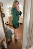 I bought this dress for a Christmas party and I really can't say enough good things about this dress. It's SO cute and flattering! The material is so so soft and the color is perfect, just as advertised. I have a hard time finding dresses that are the right length for me because I'm only 5' tall and the length of this dress was perfect. This being said, taller girlies beware because this dress does seem to run short. The only very minimal issue that I have with the dress is that it seems a little big in the bust area (for me with a 34B) which makes the shoulders fit a little loose and prone to slipping; however, when I tried it on with a pushup style bra the issue was fixed! So I'd say it's got extra room for the girls more blessed in the chest area and maybe a little baggie for the smaller-chested ladies.
Also, the sleeves are a *tad* long for me (short arms) but when the sleeves are tight enough when buttoned that it's not noticeable, and they stay in place around my wrists. - Haley W.