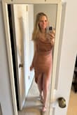 Bought this to wear to a NYE event this year (after I steam it). A bit short in the front, but I'm able to walk in it without it riding up too high. I'm 5'6 and got the XS; the length would likely be better if I sized up. - Cassie E.