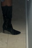 I am a 6.5 and bought a 7 based because the size chart said a 6.5 was a 37 and I was nervous it wouldn't fit so I sized up to 7/38 and while the shoe fits fine not super loose but with room the pointy tip is too long kind gives witchy vibes lol I just feel it throws off my proportions down there it could be me so I reordered and got the 6.5 in both black and white because ultimately it was the style I was going for and I can't find a western boot anywhere with a thin heel that's suede! I got my first pair on Black Friday on sale and now I'm repurchasing at full price so I hope that's enough to show that the quality is there and if ur thinking of buying it I'd get it. I wouldn't say they aren't wide calf friendly I have a pretty medium calf.. but again I did size up so there was a good amount of space to slide on and off so if you are worried the shoe (the black suede pair) may not have enough room I feel it is kinda workable if u get a size smaller. - Toi L.