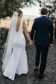 I ordered this dress on a whim as an "option" because it was less than $100. Surprisingly, it checked a lot of my boxes in what I was looking for in a wedding dress. I didn't have super high hopes, but I ended up liking it more than any of the way more expensive dresses I tried at higher end stores. It fit almost perfectly; all I needed to alter were the straps because they were a little too long. The length was perfect for me with 2-3 inch heels. The material felt very high quality without being too heavy, and it was very stretchy and easy to move and dance in! Literally couldn't have asked for a better dress! - Hanna H.