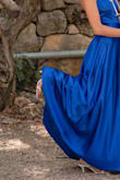Attending my brother's wedding, I chose this dress and it was an absolute hit! The royal blue color, paired with the backless design, exuded elegance, earning me numerous compliments throughout the celebration. The impeccable fit and comfortable style made me feel confident and beautiful. - Maya S.