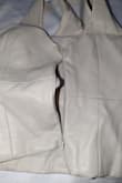I was so excited when I received this...the quality feels super nice and soft. Unfortunately, the zipper is of terrible quality. The very first time I tried to wear this top, the zipper broke. I could barely get the top off without having to cut it. I wish I hadn't taken the tag off. Don't waste your money on this. - Nicole B.
