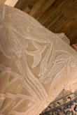 This dress is gorgeous. I am wearing this for my wedding. It has sequins that are so pretty. The sequins do come off which is a bit annoying but for the price, this is still such a beautiful dress. - Carol C.