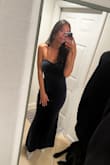 I took a risk on this dress and I am so happy with it. It fit me like a dream and while form fitting it is still super comfortable and I was able to walk up and down stairs and dance with no problem. I didn't feel the need to pull it up very much either. The cut is very flattering for me and I received many compliments. I wore this to a black tie wedding with silver accessories and absolutely loved it. - Melanie U.