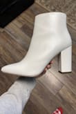 The booties are so cute and the size and color are perfect. I get compliments when I wear them! The only reason I gave 4 stars was because the heel kinda moves and makes noise when you shift your weight from one foot to the other but it wasn't noticeable to anyone else or even to me after a few minutes of wear. - Amanda W.
