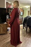 I bought this dress for a formal winter wedding. It's beautiful and fits great. It hides the stomach area and shows just enough back to look a little sexy and still be modest. The price was very reasonable. Cons: the zipper isn't the greatest and was getting stuck where the fabric gathers across the rib cage. I had to change it out. Other than that, I got a really good buy. - Dana C.