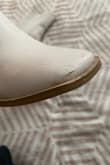 I loved these when they came in but I've only worn them once and they are already showing signs of wear and tear. The fabric has snagged, the faux leather has scuffs/scratches that won't buff out, and the color on the sole of the shoe is chipping off revealing a different color underneath. This is so disappointing considering the cost of the boots. I like the style but they are not made to last. I also normally wear an 8-8.5 but had to exchange it for a 9 because the 8.5 was too tight and uncomfortable. - Stacy B.