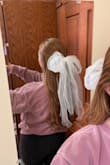 I got this bow with my bachelorette party in mind! It's so cute to wear on its own but will also be the perfect mini veil! Love how fluffy and long it is! - Megan V.