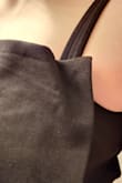 You can see in my photos that the top of the dress is sewn to the straps incorrectly. Rather than making a straight line with a neat point like in the photos, the line of the top is lumpy/irregular because the fabric is sewn in the wrong place. I could probably re-sew it myself if I really loved the dress but I don't think it's worth it. - Rebecca L.