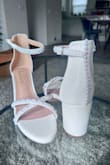 I scoured the internet looking for the perfect wedding shoe, but could not find one that checked ALL of my boxes: white, 3" height, block heel (for grass), comfortable, affordable, AND adorned with pearls. Lulus shoes have always been very comfortable for me and this shoe fit all of the criteria EXCEPT the pearls. So, I purchased a $10 pearl kit on Amazon, some JB weld super glue and got to work making myself exactly what I wanted! It took about 3 hours total (1.5 hours for each shoe) and they turned out AMAZING! :) - Melissa L.