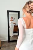 I ordered 10 dresses from Lulus for my small beach elopement/wedding next February. I was able to contact customer service to let them know that this was the reason for my large order and they noted that in my account to prevent any return issues and we also received one clothing bag to store my dress.

While one or two were not my style or didn't fit quite right, I was pleasantly surprised to like the majority of the dresses I tried on! Seeing as typically wedding dresses can be very expensive, I was worried about the quality of the dresses, but I was very impressed. I would recommend this to anyone who is looking to save some money, but still find the dress of their dreams!

(Neither of these pics is the dress I ended up choosing, but my two runner-ups!) - Claudia M.
