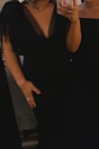 I purchased this dress for my James Bond-themed work holiday party and it was perfect! It fits like a glove and the material has some give to it so it is stretchy where you need it to be. There's not an overwhelming amount of tool like I thought there was so it wasn't over the top or felt like it was too poofy at the top where you think it's giving you extra fabric in the wrong areas, the dress was super flattering and got so many compliments. One thing to note is that the dress was a little long even wearing heels BUT you could definitely wear taller heels or scrunch up the dress in areas so that way you're not tripping, it does have a little train in the back which I loved. - Mya S.