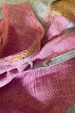 The first time I tried the dress on, it fit perfectly so I packed it for my honeymoon. The second time I put it on, the inside button fell off- without pressure being put on it, and the top clasp ended up falling off as well. I was very sad that the dress literally fell apart within minutes. - Cali C.