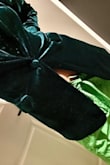 I like the color and velvet material.  The fit is good but I would be adding a holiday clip in the back to have it fit a bit closer to my body.  I can also wear it as is.  It will just fit looser.  The shoulders and length were on point! - Vanessa B.