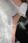 I adore this little dress! It has such a cute floral texture, is not too short, and is true to size. I got it for my bridal shower in May - it is a cute spring cupcake dress. - Kasey D.