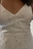 I ordered this as a potential elopement dress, and although I didn't end up keeping it, I absolutely loved it. As soon as I put it on I felt like a princess. I was obsessed with the level of detail (love the subtle shimmer from the sequins, the delicate flowers, and the hint of silver/gray). The website pics don't really do them justice. Note that the straps are fully adjustable - it's just one long strap on each side, so it requires a lot of pulling and tugging to get them just right. This is a huge benefit in terms of fit, but as someone who will be getting ready by herself, it wouldn't be ideal. It's super lightweight, so would be amazing for a warm climate. The medium fit me perfectly (see measurements). Ultimately, I just don't see myself getting married in it, but I would love to wear it to another event one day! - Natalie J.