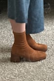 These boots are so cute! The heel isn't too high to make them uncomfortable. The soles are squishy so they're pretty comfortable to wear and walk in. I could have ordered a half-size down. For reference, my foot is 9.25 inches. - Rachel H.