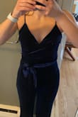 I think this would look great on some people, it just wasn't flattering on me. I had to size down to an XS so the top wouldn't be too loose, but that meant the jumpsuit lost its flowy fit and was more fitted through my hips which didn't look great. It seems to look much better on people with a larger chest. - Michele S.