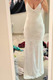 I really liked the fit of this dress - maybe a little more flattering if you have thinner hips than mine.:) The front and the lace up back are very sexy - just a little too much for my conservative family at my wedding. Otherwise loved it. - Emily B.