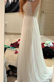 Love the side mesh, and very pretty in the front. Didn't love the open back, and it was too revealing for the conservative family members at my wedding, but it was really pretty. - Emily B.