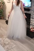 It's a beautiful dress. It's a little tight and I'll need to have it taken out. The straps are also very thin and dig into my shoulders. However, I love the dress and just need to alter it! - Adri M.