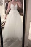 It was beautiful and giant like a princess with a train. I loved it but it really cut into my armpits and the straps were uncomfortable. The chest area was too tight and hard to breathe as well. However, it's absolutely gorgeous and I would have gotten it in a size larger but liked another dress better. - Adri M.