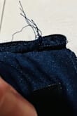 Dress runs small. Also, there were strings by the inside of the zipper that seemed like it was coming apart. I wanted to like the dress because of the style but it just didn't work out. - Elke I.