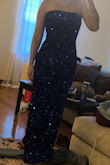 I read the previous reviews and sized down to an extra small. The shimmer on the sequins was beyond perfect! I love this dress so much. I highly recommend purchasing it. - Leslie H.