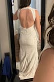 I really liked the shape of this dress and the quality of the lace. However, it will be going back because the lack of structure in the bust makes me look very shapeless and the slit down the middle (not off to the side) is a weird placement. Ordered size L but would need to size up if I were keeping it. 5'4", 36 bust, 29.5 waist, 41 hip. - Melinda H.
