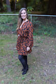 I love this dress but wish I had ordered it in an xs, as it is quite large around the middle; being petite, it would look better in the smaller size. - Elizabeth T.