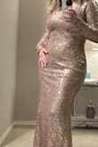 Dress is beautiful; the only problem is that the sequins kept falling off. I don't think I will use it ever again; it's one of those that you only use once. - Nora H.
