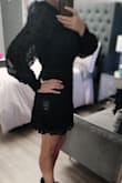 I'm starting to see that I'm probably between a size small and medium on Lulus product but based on the sizing chart. It shows I should be a medium. So, it's a little frustrating as this is a little large in the waist for me. Even elasticized, I have a couple of inches. I do think it's pretty cute though and will keep the sizing. It did need a few thread cleanups as the was a serger line exposed at the waist and loose threads on cuffs etc. The front lacing was a little more revealing than I had anticipated based on reviews and photos so I would likely wear a nude colour tank top or bandeau if I wear it with a blazer for work. I do like that it's below my fingertips in length (even with my long nails) to keep it appropriate. - Tracie R.