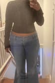 It's a cute solid black tight turtleneck. Admittedly I didn't read "cropped" when I ordered it. From the model pic, the shirt seemed to be tucked into jeans. My fault completely for not reading cropped. I'm not mad at it though. It's super cute. - Michelle J.