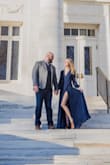 I bought this dress in a size small 2021 in navy for my engagement photos and absolutely loved it! I have since had a baby and am a little bigger, so ordered it in a size medium green and am equally as happy! The material is heavy and hangs beautifully and I feel very secure in this dress! The wrap does not feel like it will come undone and gives you total flexibility on the cleavage and the slit! I will be wearing the new green one to a wedding in February so I do not have a photo of that dress yet, but here is the navy small! - Brielle S.