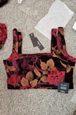 I wanted to love this! The material was absolutely beautiful and I could tell it would be cute, but didn't fit me. There is a huge difference between sizes. I ordered my normal size large and was way too big and lost its shape so I sized down to a medium and couldn't even get it zipped. This set is so beautiful, but if you're between sizes or have a curvy bottom, this may not work! - Kara W.