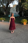 Wore this dress to an outdoor wedding and received tons of compliments the whole night! Great quality, the material felt comfortable and wasn't itchy at all. The layers with the polka dots were such a cute detail. I have a small chest, wide hips, and an athletic build. The shoulder straps were adjustable. The dress fit perfectly in all the right places. Absolutely no complaints whatsoever. - Miranda C.