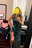 Love the dress. I will say the fabric is black velvet-ish. The sequins are green/blue iridescent. Depending on the light, you will see the color.  I wished it was more green, but still a beautiful dress.  I ordered a large and the fabric has some stretch. I could have downsized to a medium for a more fitted fit around my waist. I stayed with the large, due to my chest size. This is my second year finding my Mardi Gras Ball dress at Lulu's. I tried cheaper dresses elsewhere, but Lulu's quality for the price keeps me coming back. - Linda S.