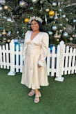As soon as I saw this dress I knew it was the one. I had a court wedding and I didn't want a traditional wedding dress but this dress was just perfect. The quality of this dress was magnificent. It's more beautiful in person than it is on the website. The dress came out beautifully in our announcement photos. - Tuai F.
