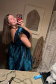 This dress is amazing! Very pretty color and a perfect length. My mom even loved it! I did have to iron the dress (wasn't ironed in the picture) after I had tried it on because of the lines from the folding in the packaging. The dress fits PERFECT and makes me look pretty small at the waist. What I love most about the dress is the neckline and the back of the dress; the fact that the shoulders have a rubber strip on the inside so the sleeves stay in place made this dress even more perfect for me! Overall, this dress is wonderful, and I would totally recommend! - Ariel V.