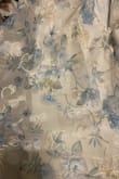 The dress is really cute but VERY large in the chest. I am normally a XS-S however the top of the dress fits more like a M-L. The dress also has gold detailing that I wasn't expecting. - Sierra B.