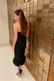 Wore this dress to a friend's winter wedding where the venue was a vintage bank converted into an event space. It fit the vibe so well and I got so many compliments. The fit is beautiful -I by no means am curvy but it gave me more shape than most dresses due to the structure of the fabric and how it hugs the body. If you want old Hollywood glamour with a modern, she's your girl! - Alisha M.