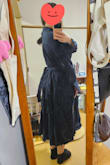 I guess I imagined it a little different than what it turned out. It's made from a rougher fabric than I thought, very thick and wrinkles easily. Lays on my body frumpy. It has a super deep neckline, but the rest of it looks very much like a work outfit or a detective jacket. I'm not sure how to wear it. There's no zipper or elastic band. - Michelle M.